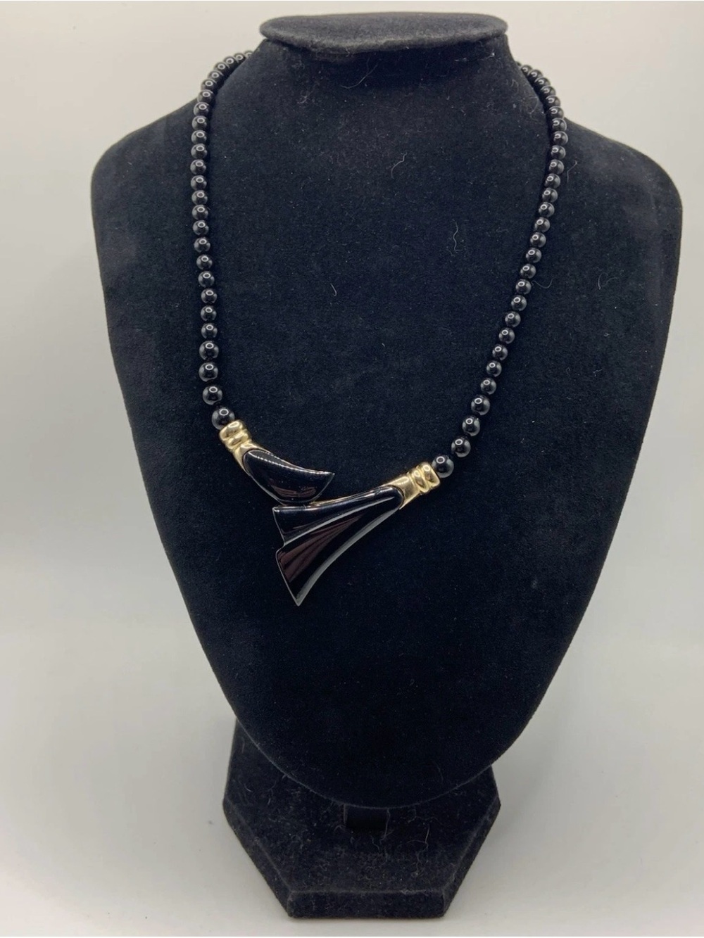 Black Bead Necklace with Gold Accents and Sculpted Fan Pendants